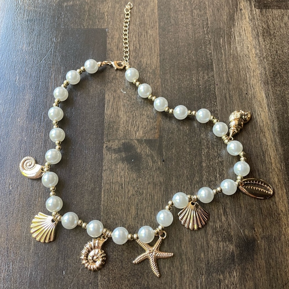 Anthropologie Gold and White Pearl Necklace with Ocean Charms